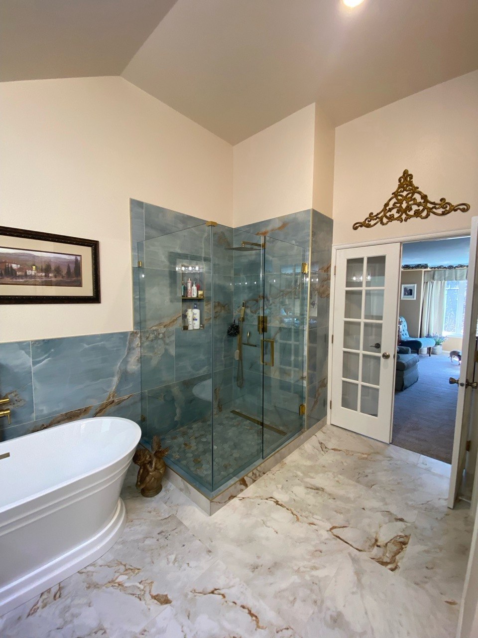 Brass fixture shower detail with onyx niche