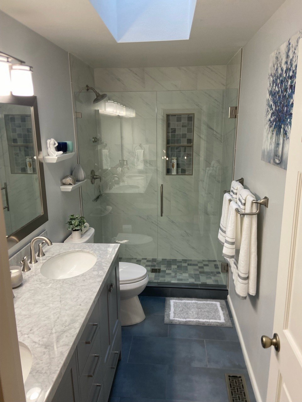 Marble tile bathroom with glass shower